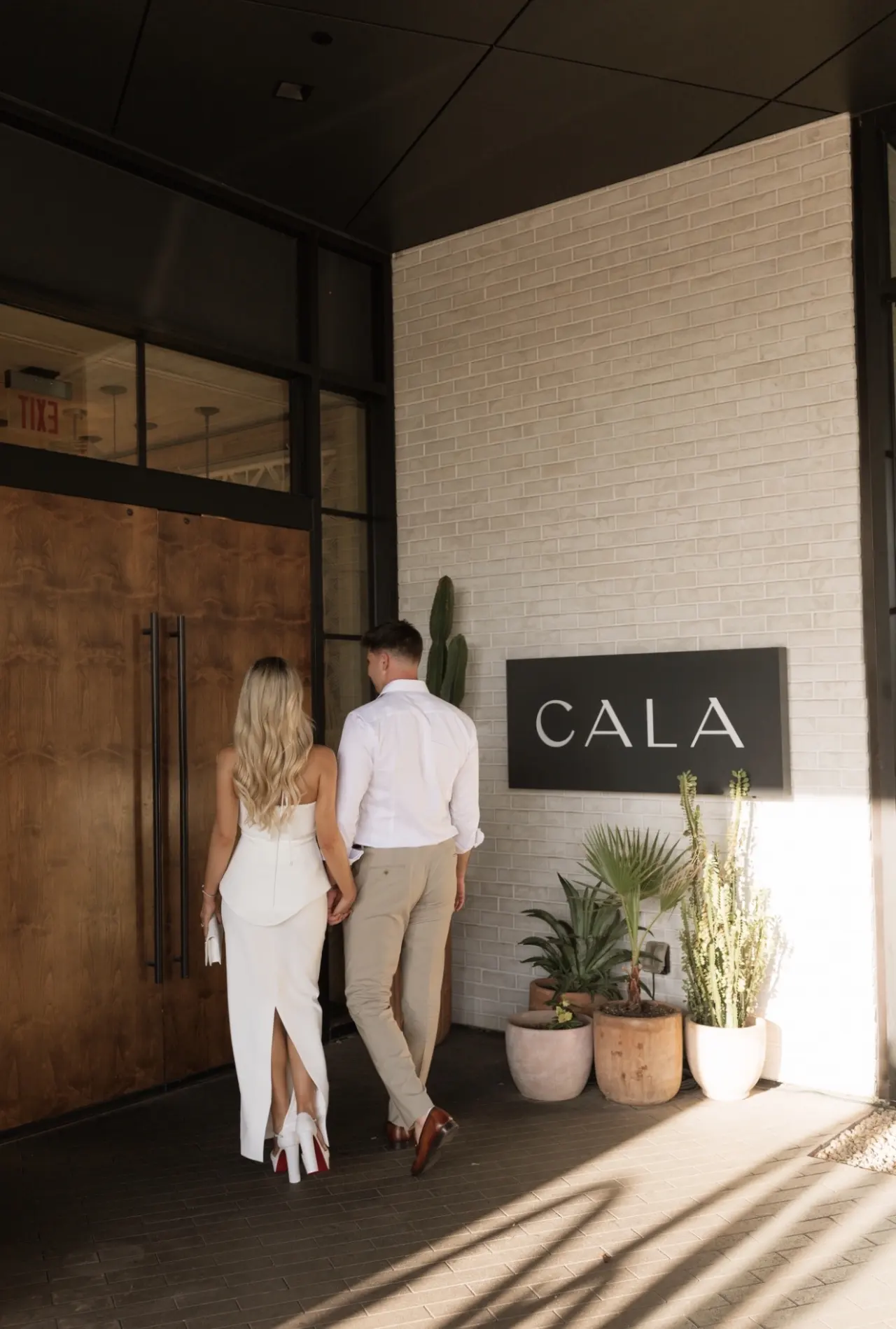 A couple walking into CALA