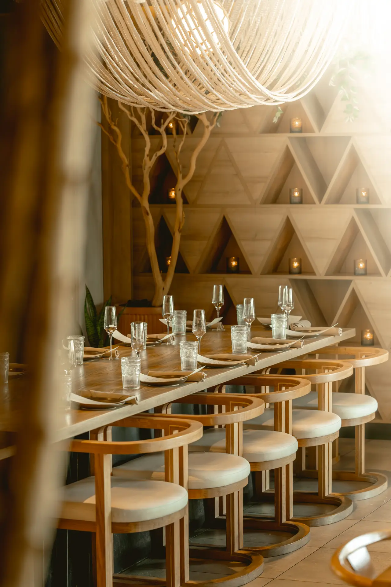 The long table under the rope chandelier