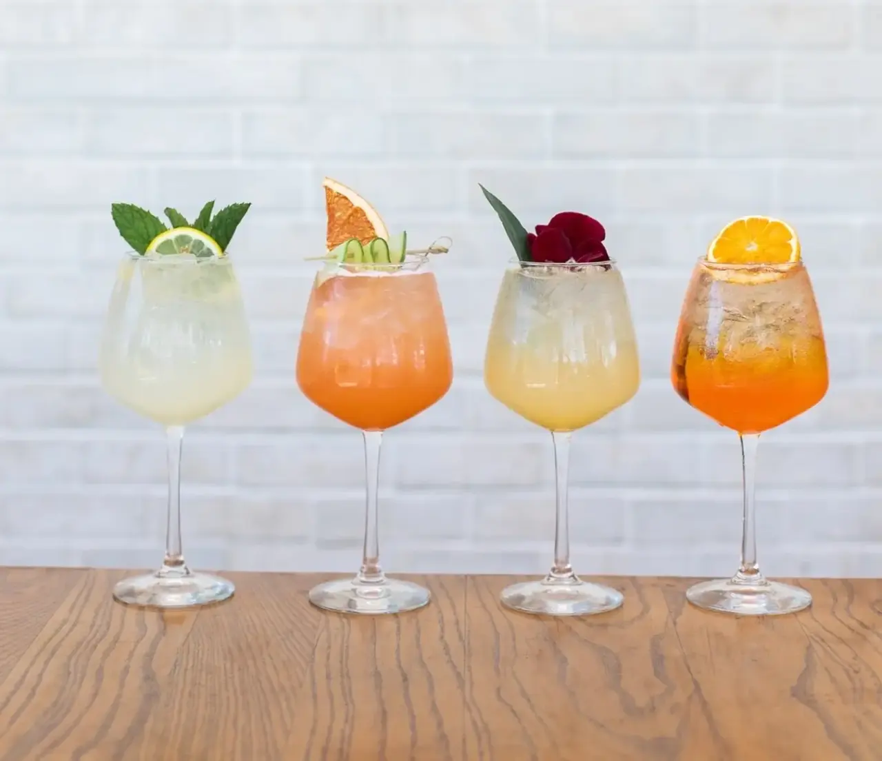 Four spritzes lined up on the bar