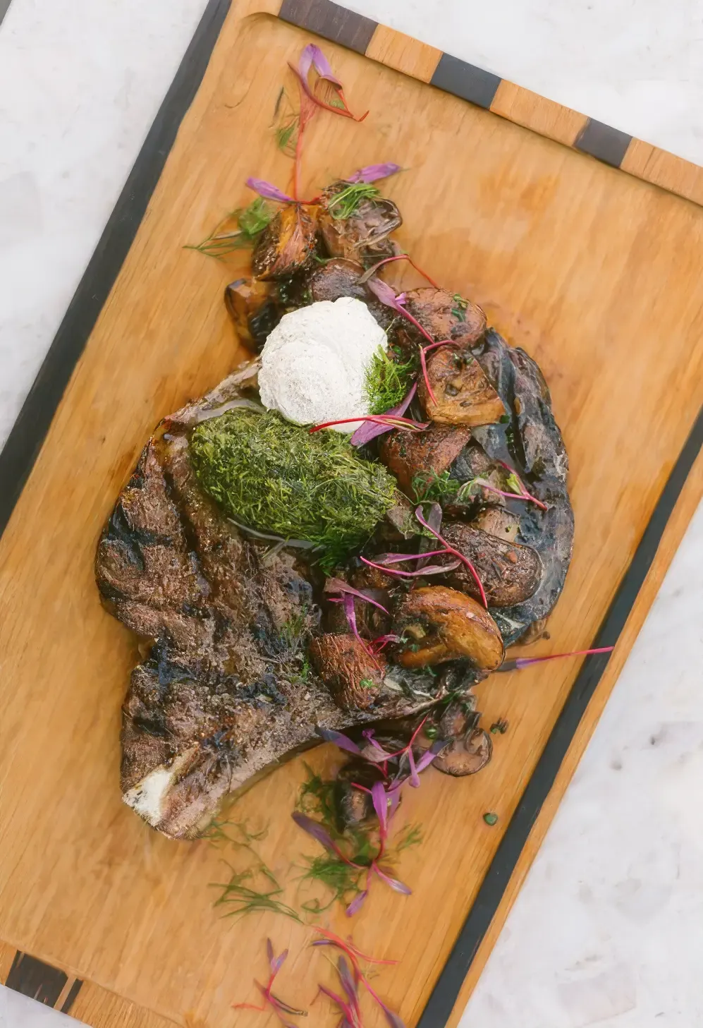 Steak with chimichurri on a board